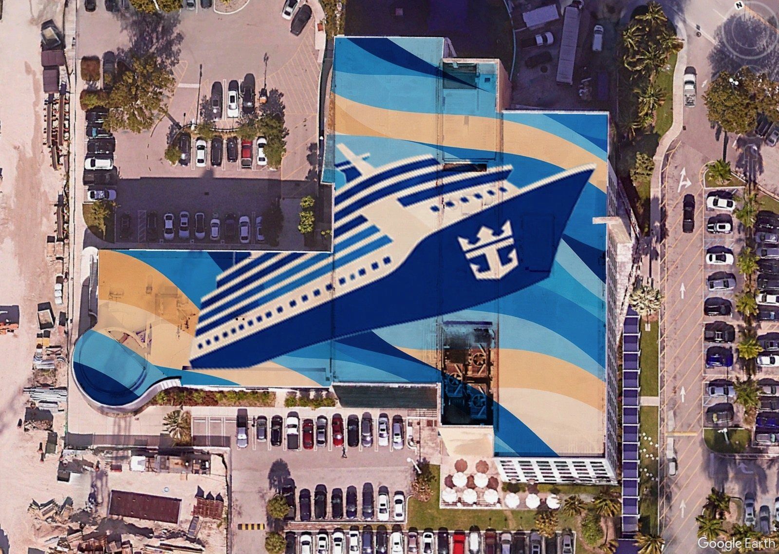 Aerial view of a rooftop artwork of a cruise ship crossing blue and sand waves, Royal Caribbean campus, Miami